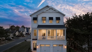 A two-story house with a balcony and a garage. - Fenwick on Bay mins to beach. Hot tub, Game Rm! (Selbyville)
