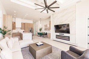 Smart TV, fireplace, books, stereo