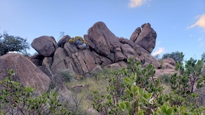 A rocky landscape with large boulders and sparse vegetation. - Boutique Hillside Hotel with Breathtaking Vistas. BBQ, Hiking Trail & Dark Skies (Oracle)