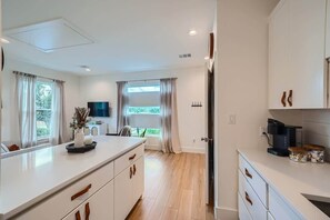 Fridge, microwave, stovetop, coffee/tea maker