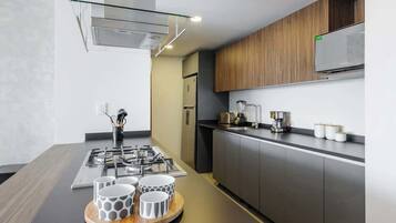 Fridge, microwave, stovetop, coffee/tea maker