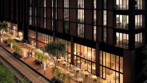 A modern hotel with a ground-level outdoor seating area and a large glass facade. - Stunning High-Rise Panoramic Apartment Polanco 3BD (Ciudad de México)