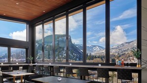 A restaurant with large windows offering mountain views. - Eagle River by Avantstay Located in the Westin (Avon)