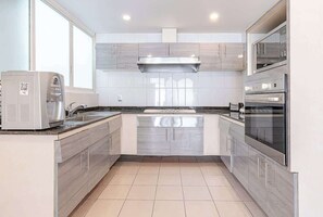 Fridge, microwave, stovetop, coffee/tea maker