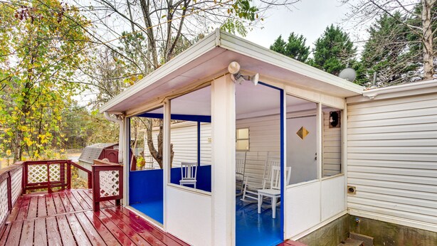 A covered outdoor area with a red deck, white walls, and blue accents. - 1 Mi to Lake Allatoona: Family Home on Farm! (Acworth)
