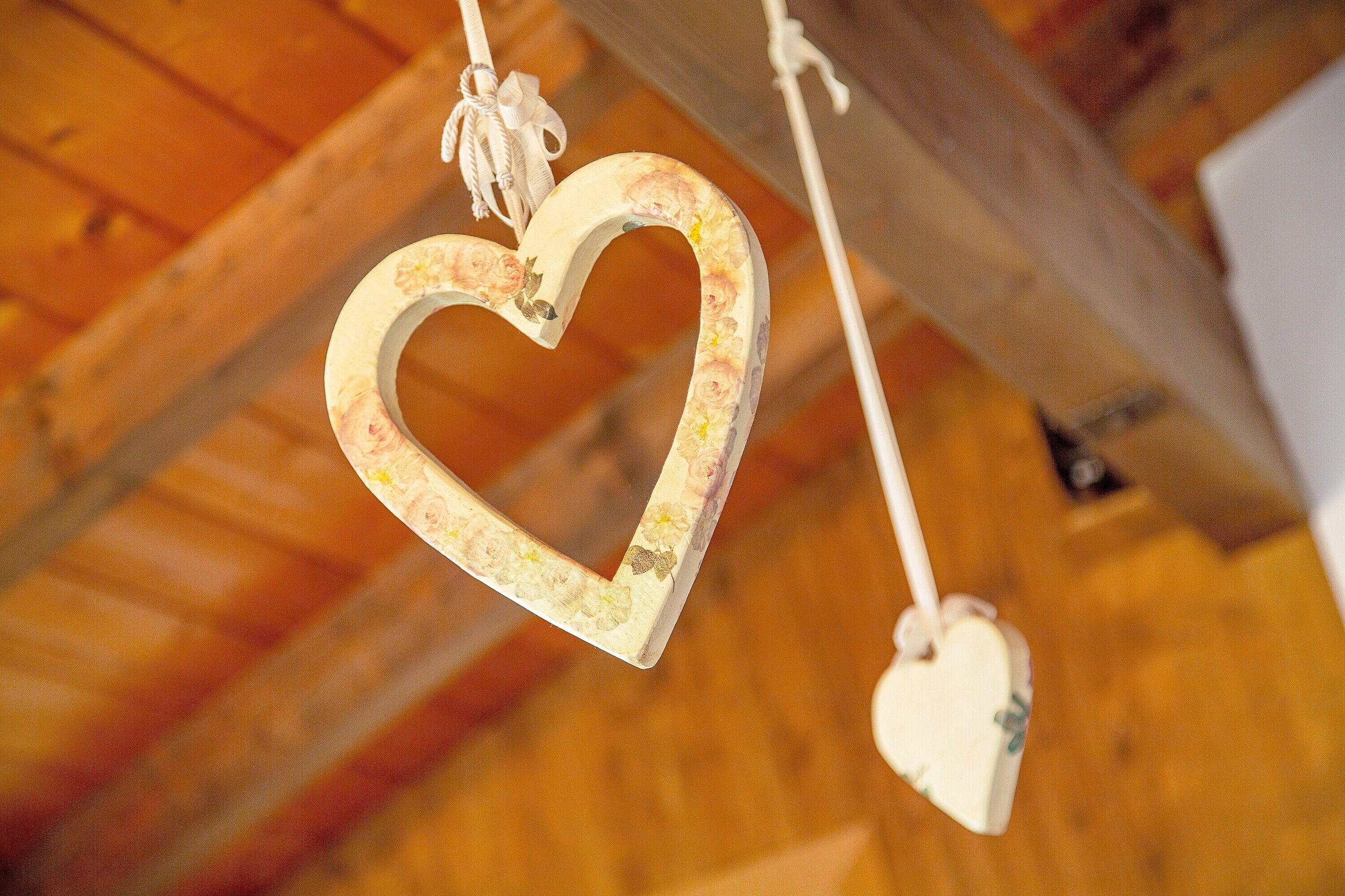A heart-shaped ornament hanging from a ceiling.