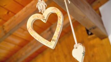 A heart-shaped ornament hanging from a ceiling.