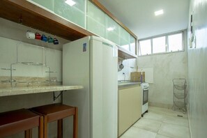 Fridge, oven, coffee/tea maker, cookware/dishes/utensils