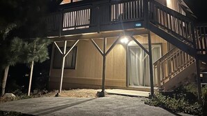 A two-story house with a balcony and large windows. - EV Charger, Dogs welcome at Sunset Ridge! (Lake Arrowhead)