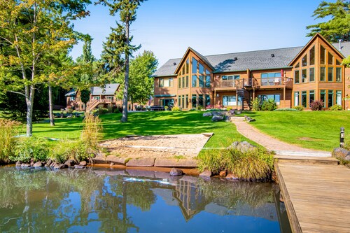 Waterfront condo with scenic balcony, fireplace, streaming, full kitchen, & W/D