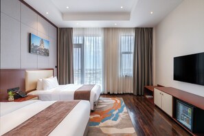 Habitación Deluxe con 2 camas individuales, vistas a la ciudad | Ropa de cama de alta calidad, minibar, caja fuerte