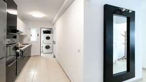 A modern kitchen with a built-in oven and a dishwasher. - Adela Homes by Best Holidays Fuerteventura (Corralejo)