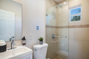 Shower, hair dryer, towels, toilet paper