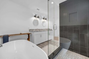 Shower, hair dryer, towels, toilet paper