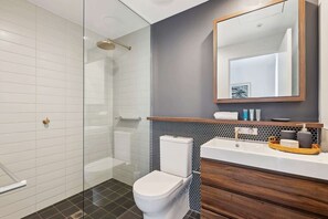 Shower, hair dryer, towels, shampoo