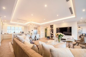 65-inch TV with satellite channels, computer monitors, printers - The Weinberg Urban Pods (Windhoek)