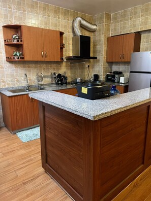 Apartment, 2 Bedrooms, Pool Access | Private kitchen | Fridge, microwave, oven, stovetop - Luxury Furnished Apartments (Nairobi)