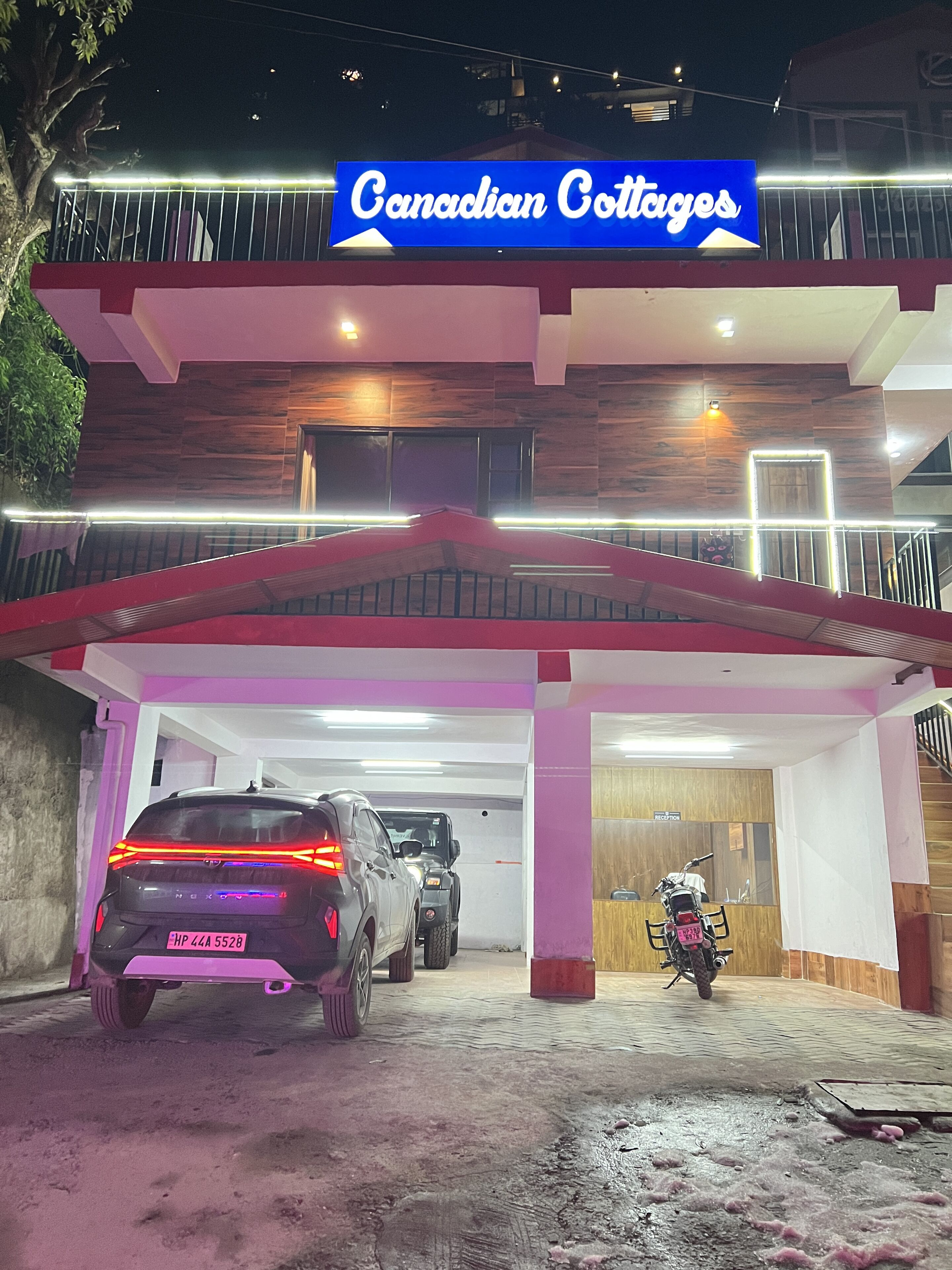 A building with a sign reading "Canadian Cottages."