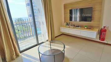 Junior Suite | Living area | 55-inch LCD TV with digital channels, Netflix, streaming services