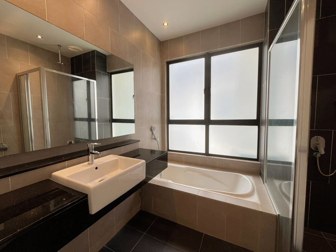 A modern bathroom with a large mirror, a white sink, a bathtub, and a frosted window.