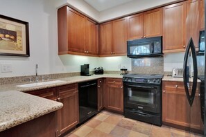 Coffee/tea maker, fridge, microwave, oven