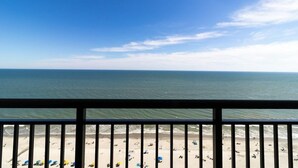 A beach view from a balcony with a railing, sandy beach, and ocean. - Your Oceanfront Oasis 21st Floor 3 Bedroom Deluxe (Myrtle Beach)