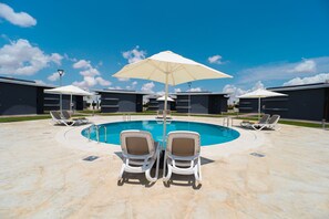 Seasonal outdoor pool, open 9:00 AM to 7:00 PM, sun loungers