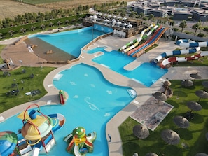 A water park with multiple pools, slides, and a wave machine.