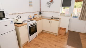 Fridge, electric kettle, toaster, cookware/dishes/utensils