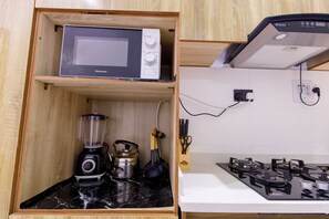 Apartment | Private kitchen | Full-sized fridge, microwave, blender, griddle