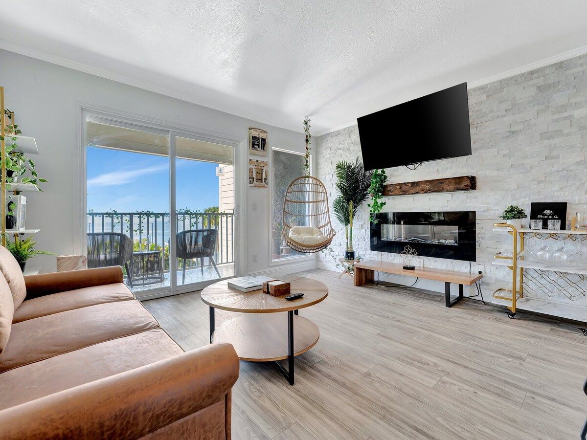 Sink into the plush sofa and let your eyes drift across the chic fireplace and modern décor. Slide open the balcony doors to feel the breeze and soak in your peaceful surroundings.