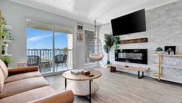 Sink into the plush sofa and let your eyes drift across the chic fireplace and modern décor. Slide open the balcony doors to feel the breeze and soak in your peaceful surroundings.