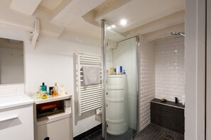 Shower, hair dryer, towels, soap