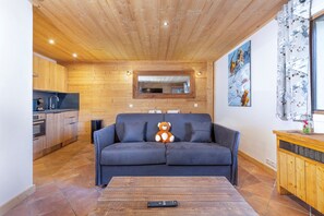 Apartment, Ensuite (au cœur de Megève ) | Living area | Flat-screen TV