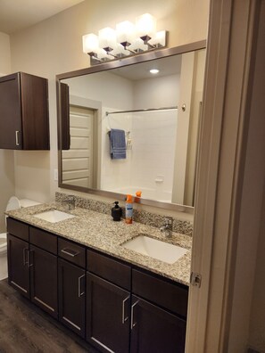 Shower, hair dryer, towels, soap