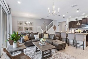 This open concept design effortlessly merges the living and  the kitchen areas, fostering a sense of spaciousness and togetherness where conversations flow and memories are made. - 5BR Townhouse w/ Private Pool & Mickey-themed Room (Davenport)