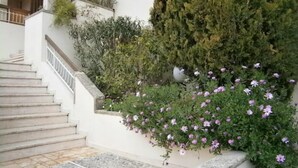 A staircase leading to a white building with a stone balustrade. - Agréable Studio Avec Cave et Parking Privatifs (La Ciotat)