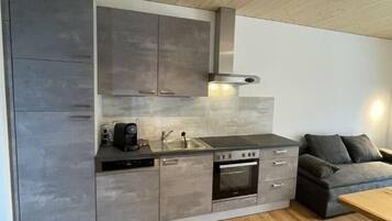 Fridge, stovetop, dishwasher, coffee/tea maker