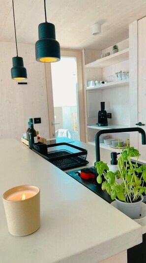 Fridge, stovetop, coffee/tea maker, electric kettle