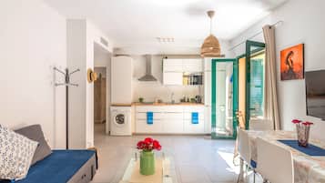Ocean Deluxe Apartment | Living area | 40-inch flat-screen TV with digital channels