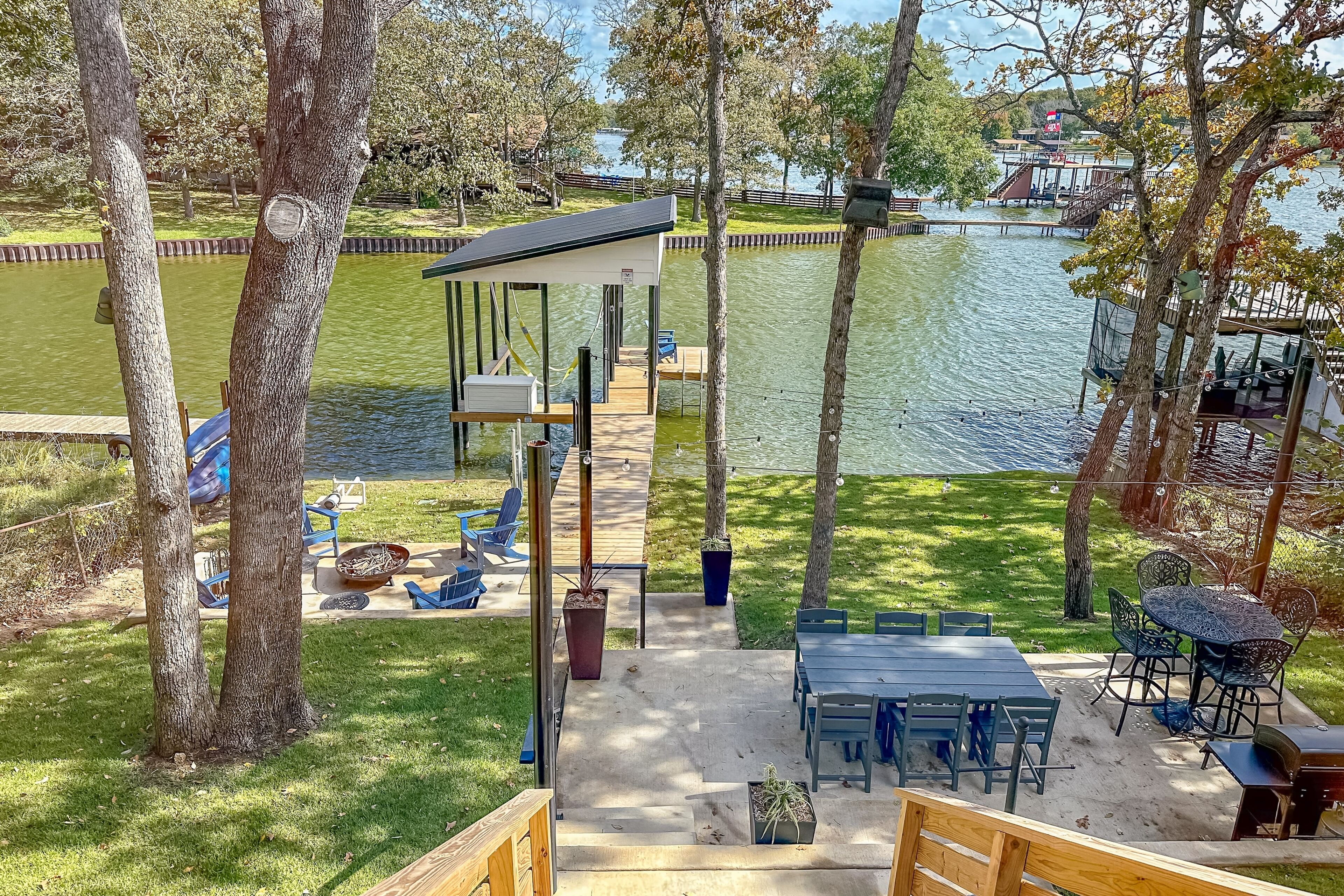 Modern waterfront home with beautiful cove views, kayaks, grill, firepit & dock