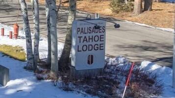 A sign for Palisades Tahoe Lodge.