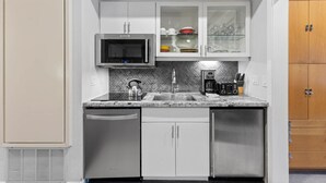 A compact kitchen with a microwave, kettle, coffee maker, and a dishwasher. - 227 | Studio Retreat - Hike & Golf Your Days Away (Olympic Valley)