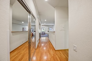 Leading to a dining area with a table and chairs.
