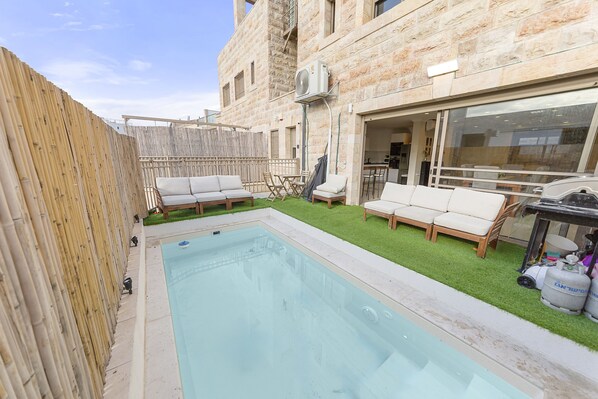 Outdoor pool, a heated pool, pool loungers