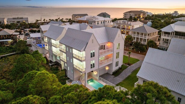 A coastal hotel with multiple buildings, a swimming pool, and a view of the ocean. - "62 Blue View" Lakefront Private Pool Short Walk to the Beach (Santa Rosa Beach)