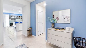 A modern kitchen with white cabinets, a black countertop, and a stainless steel sink. - Relaxing 5 Bed Townhome with Splash Pool-3966LA (Davenport)