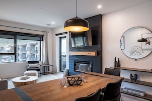 Condo | Living area | 40-inch flat-screen TV with cable channels, fireplace