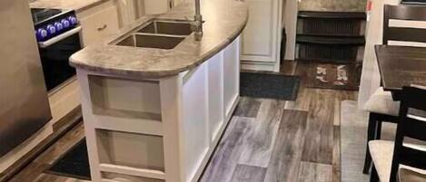 Fridge, microwave, coffee/tea maker, cookware/dishes/utensils