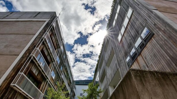 A modern building with a unique wooden facade and multiple balconies. - Two Bedroom Balcony Apartment Liverpool  (Liverpool)